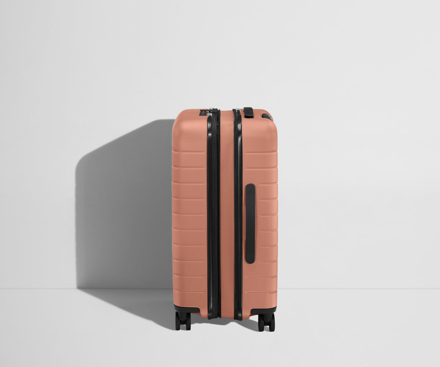 The Bigger Carry-On Flex in Clay Pink