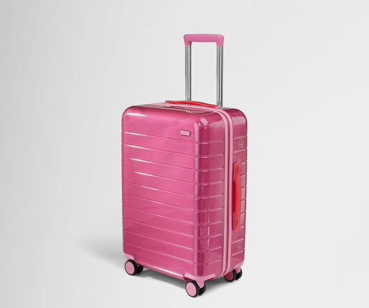 The Bigger Carry-On in Translucent Pink